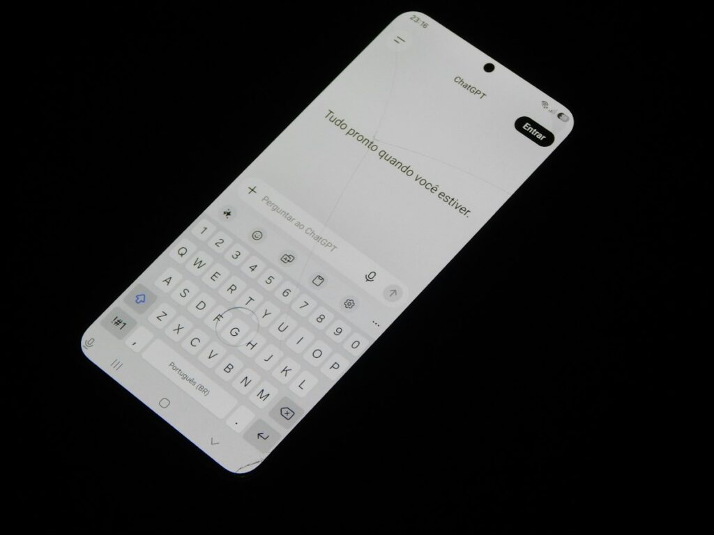 ChatGPT app open on a smartphone next to a keyboard
