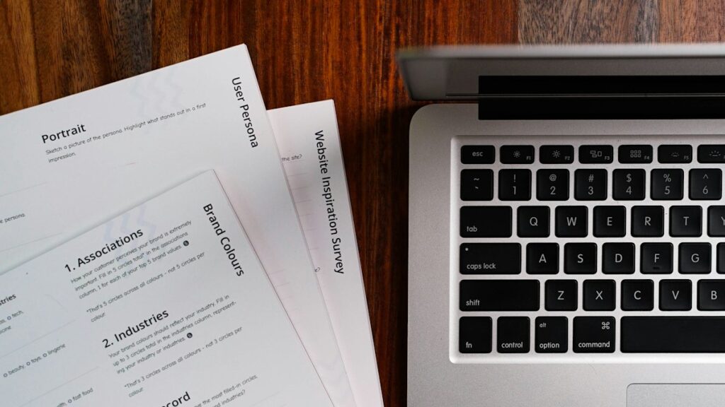 Laptop on a desk for exporting a Canva resume as a PDF